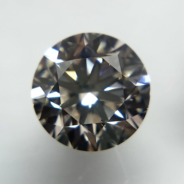 0.70 ct Round K · Faint Brown natural diamond